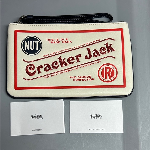 COACH & CRACKER JACKS 

LARGE LEATHER WRISTLET WITH CRACKER JACK MOTIF - Picture 1 of 7